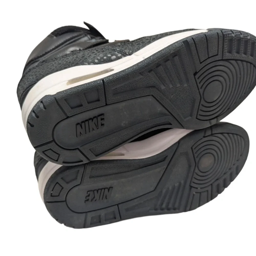 Nike Women's Black High-Top Sneakers with White Midsole Accent